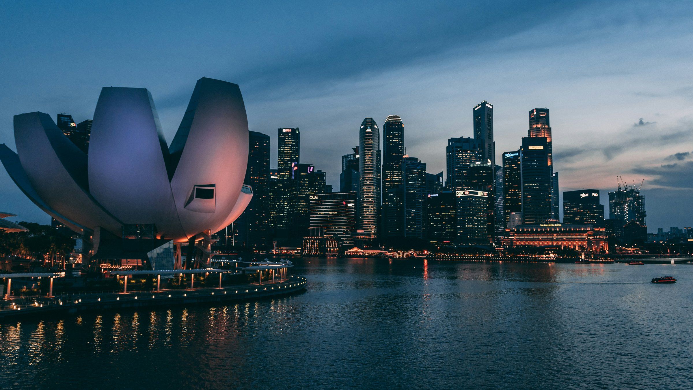 Singapore skyline at dusk with the ArtScience Museum in the foreground